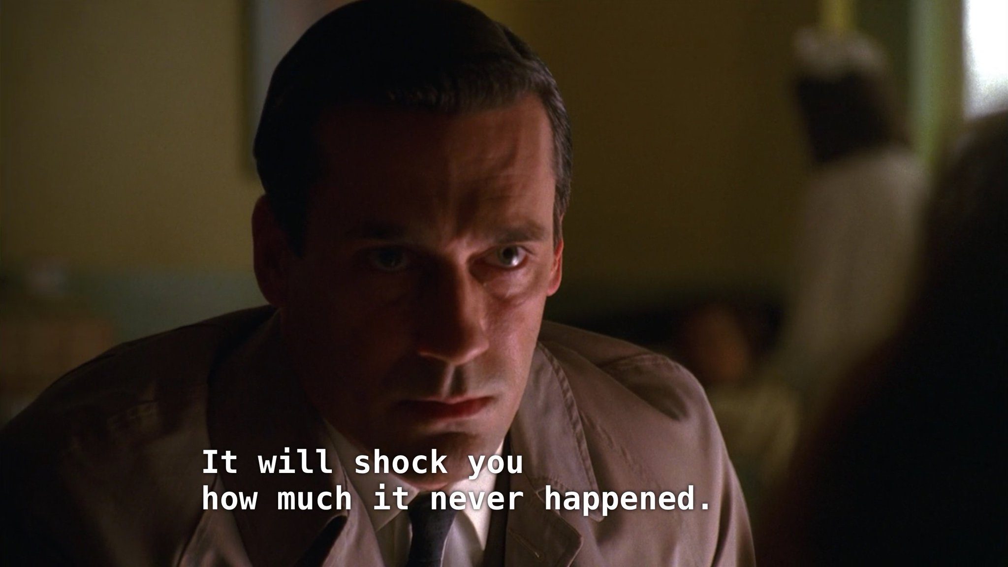 Man leaning towards camera/woman, saying "It will shock you how much it never happened."